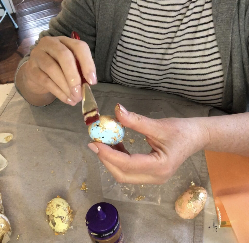 paint gold foiled egg with glue to seal
