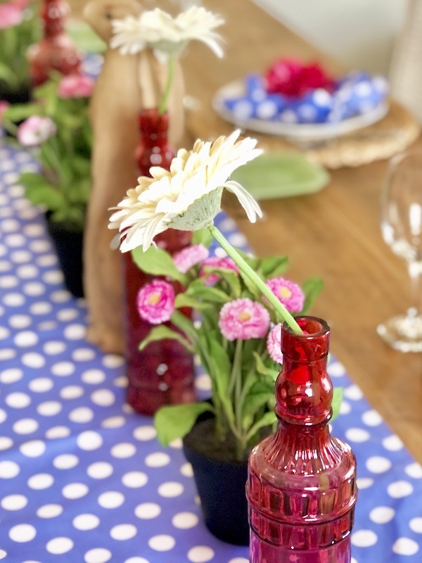 Easter centerpiece- Pink wine bottles with gerbera daisies