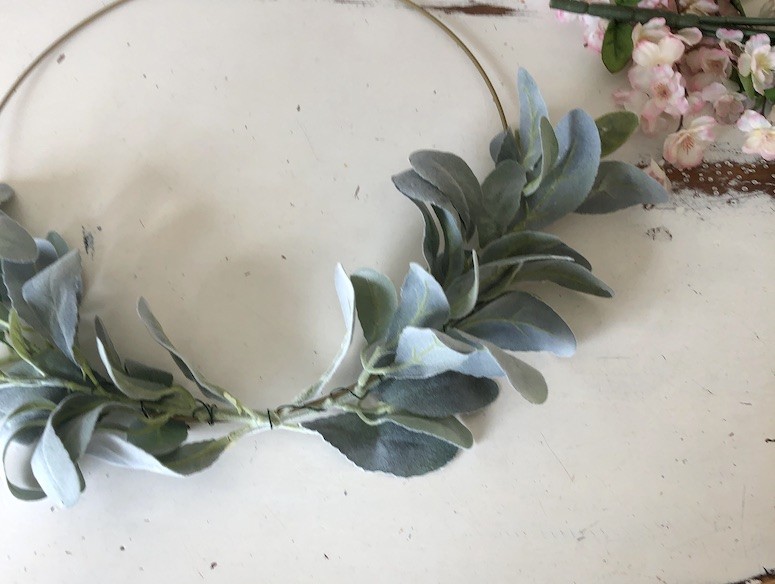 add lambs ear greenery to wire hoop