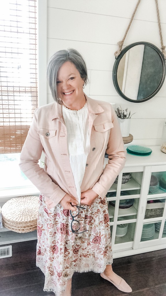 pink denim jacket over flowy skirt