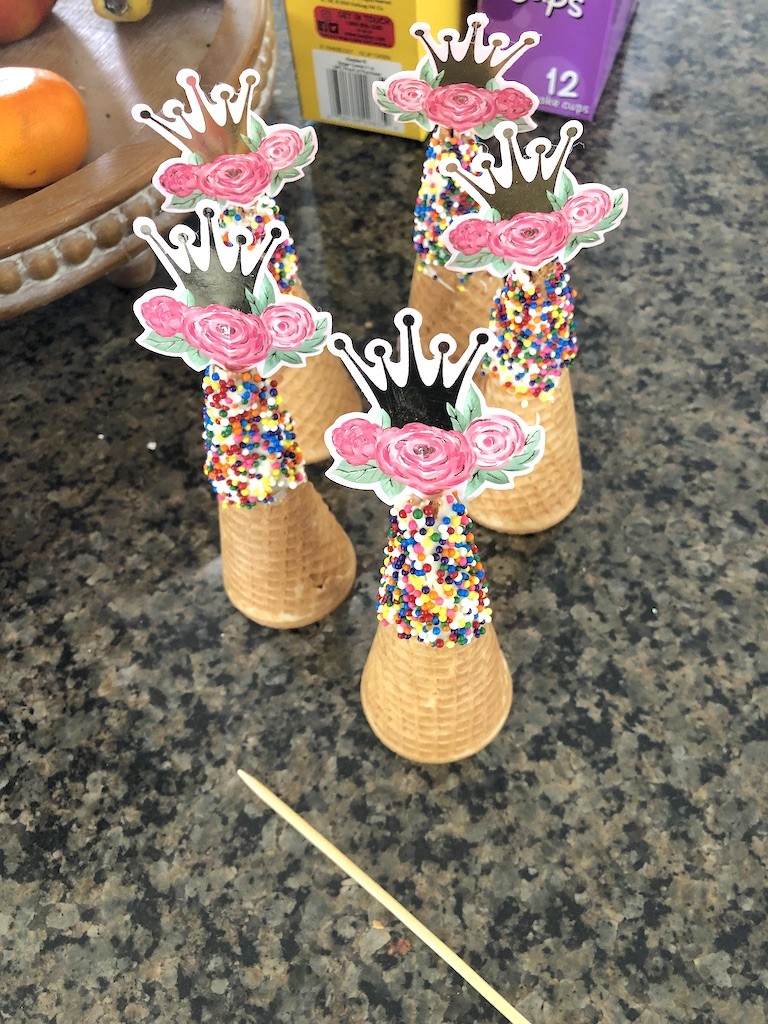 Ice cream cones with white chocolate and sprinkles