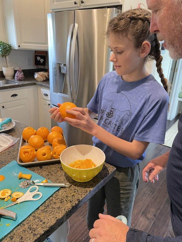 Carving oranges into jack o lanterns- Karins Kottage