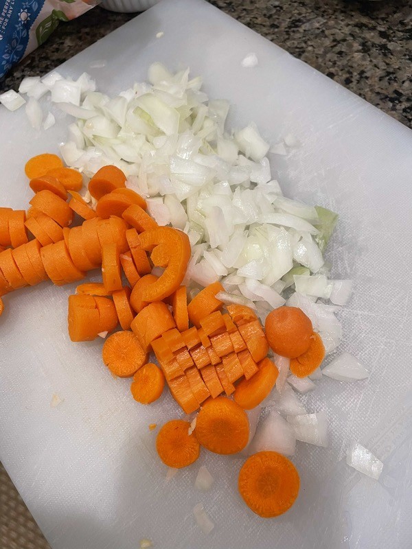 chopping carrots and onions

