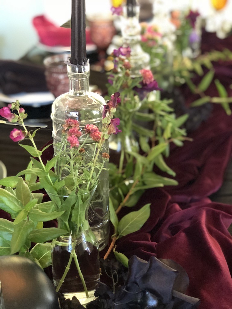 Dollar store vases used to create moody Halloween table 