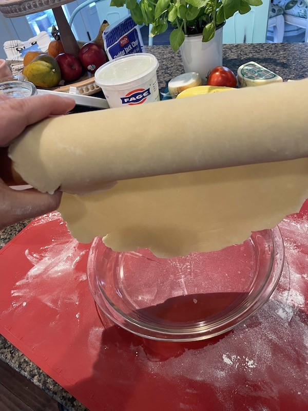 rolling up pie dough on rolling pin- Karins kottage