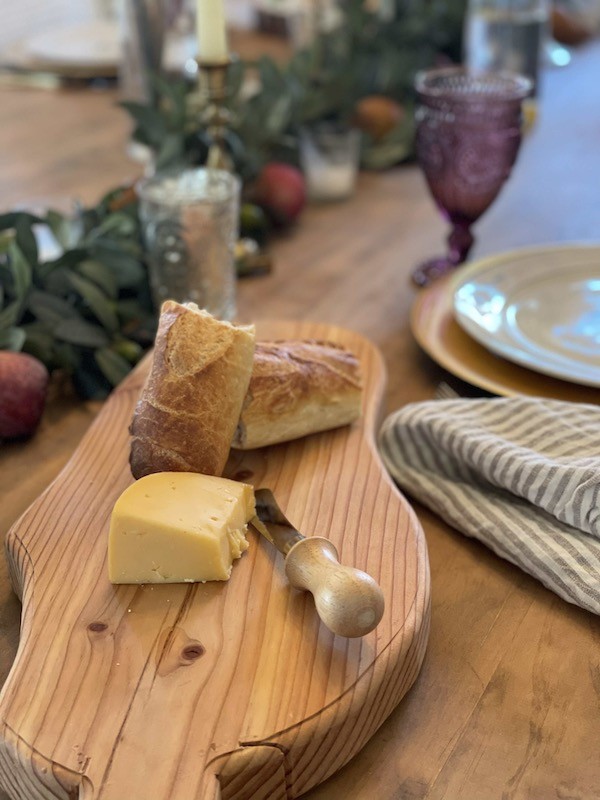 Valentine table decor tips
Wooden charcuterie board with cheese and bread- Karins Kottage