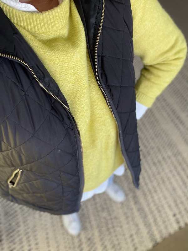 Yellow sweater layered over white blouse with black quilted vest- Karins Kottage