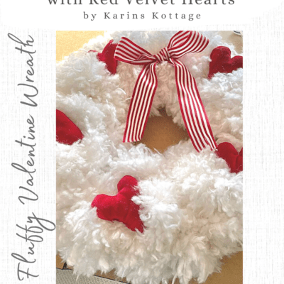 White fluffy Valentine wreath with red velvet hearts