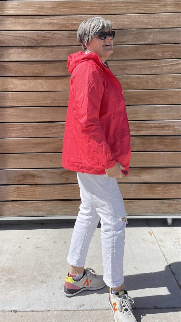 How to style a pink raincoat and white jeans