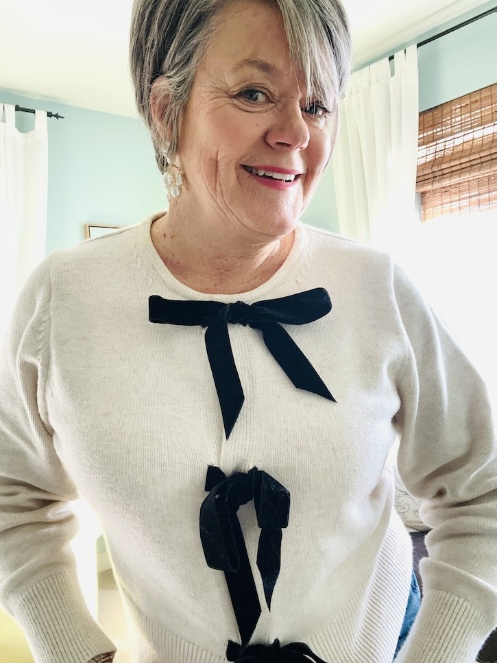 How to Style a Cream Bow Sweater 4 Ways for the Holidays