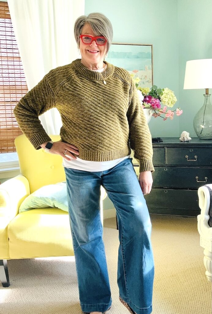 karins kottage winter outfit for women over 50 with pullover sweater and wide leg jeans