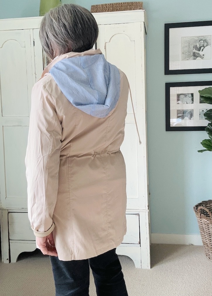 Easy layered outfit for cooler days after 50 with lightweight raincoat and flats