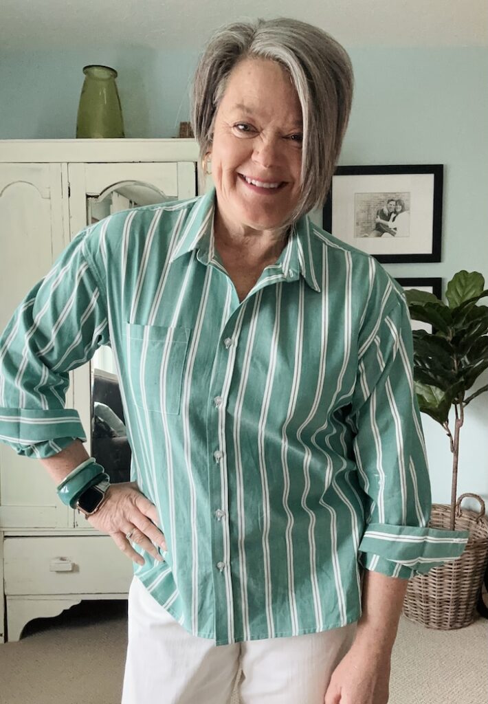 green striped blouse outfit styled with jeans for spring