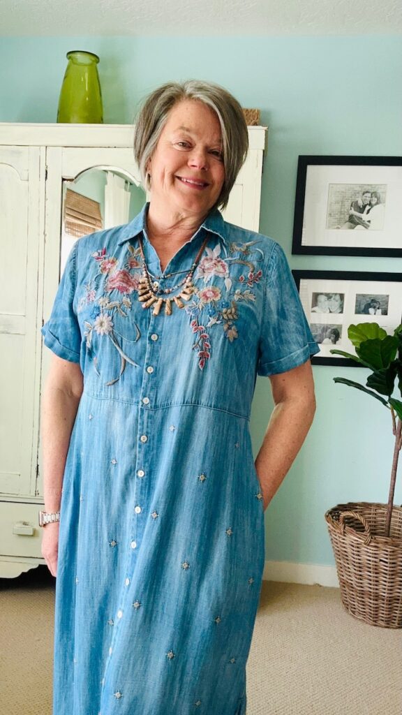 embroidered denim dress outfit with linen jacket and green flats for spring