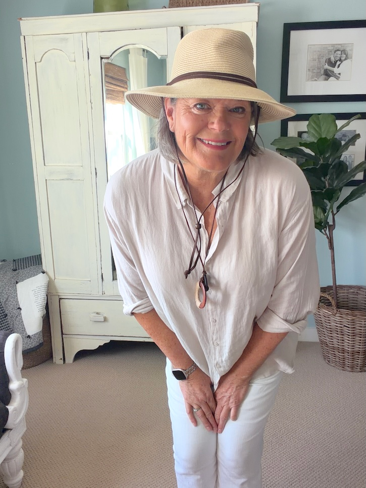 Italy travel outfit with linen shirt, black pants and sandals