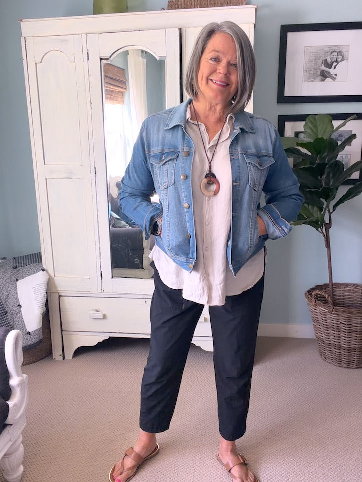 Denim jacket layered over a linen shirt for Italy travel